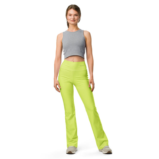 A model wearing neon green high-waisted flared leggings with a butt-lifting cut and a double-layered waistband.