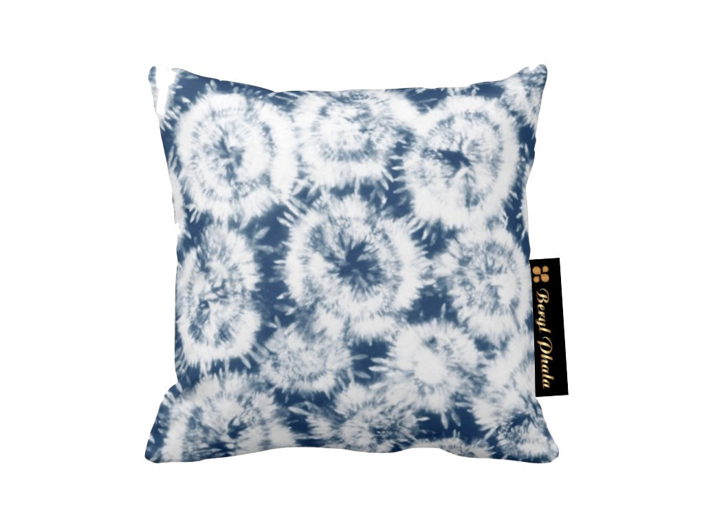 Tie-dye patterned pillow with a brand tag on a white background