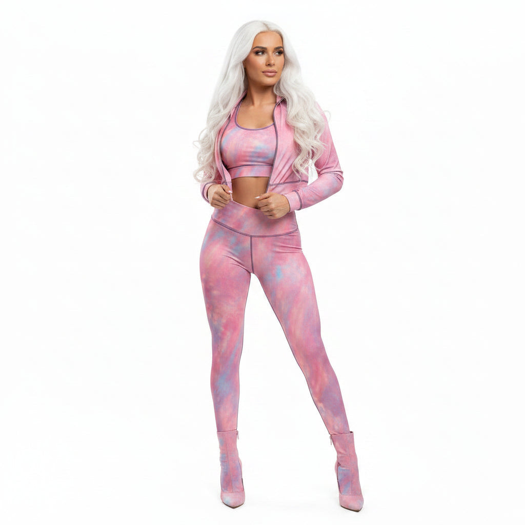 Woman wearing a pink tie-dye athletic outfit on a white background