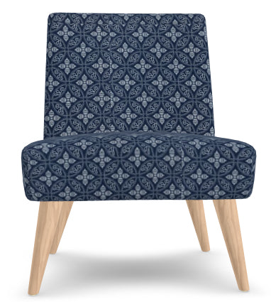 Blue patterned chair with wooden legs on a white background