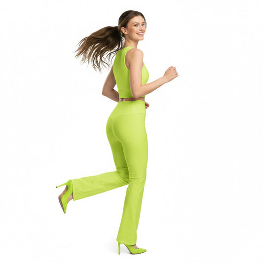 Woman in a neon green outfit running on a white background
