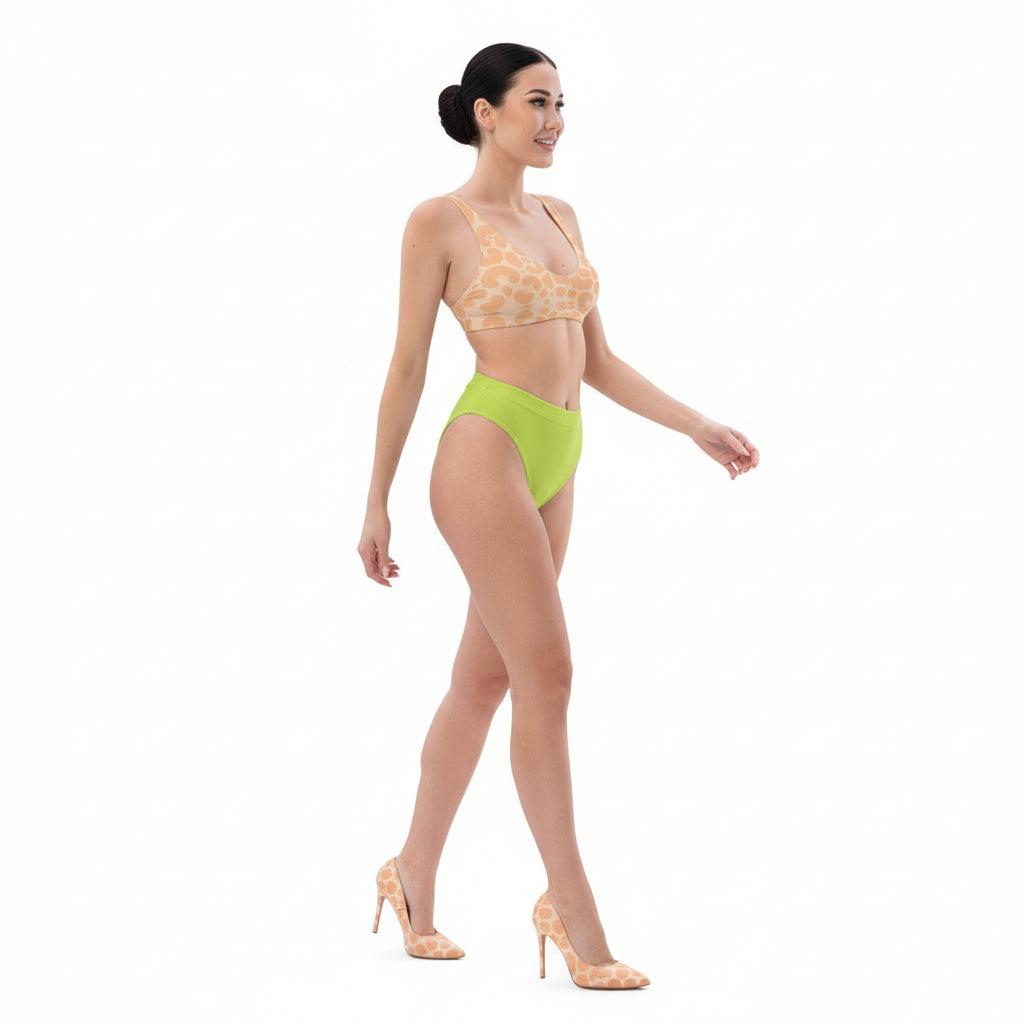 Woman wearing a yellow bikini with a white background