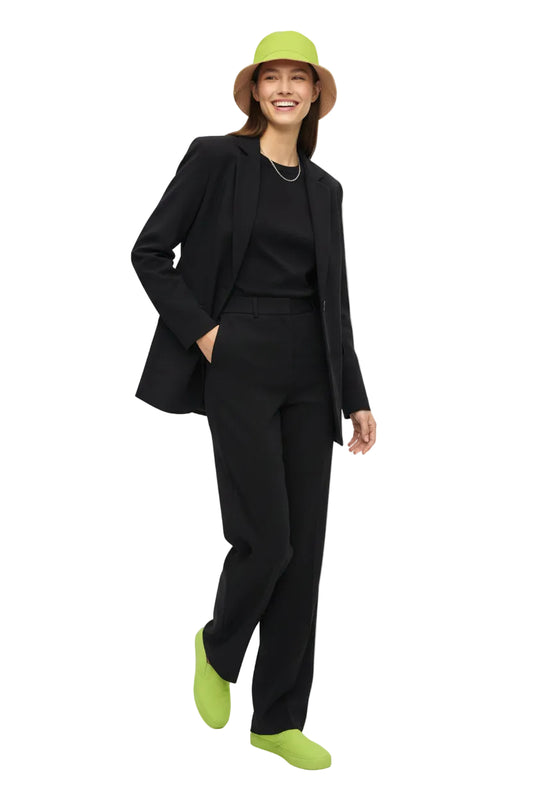 Person wearing a KhuKhuZ bucket hat with green accents on a white background