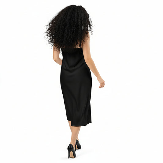 Woman wearing a black slip dress on a white background