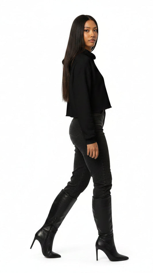 Wearing knee high boots and black jeans tucked in the boots.