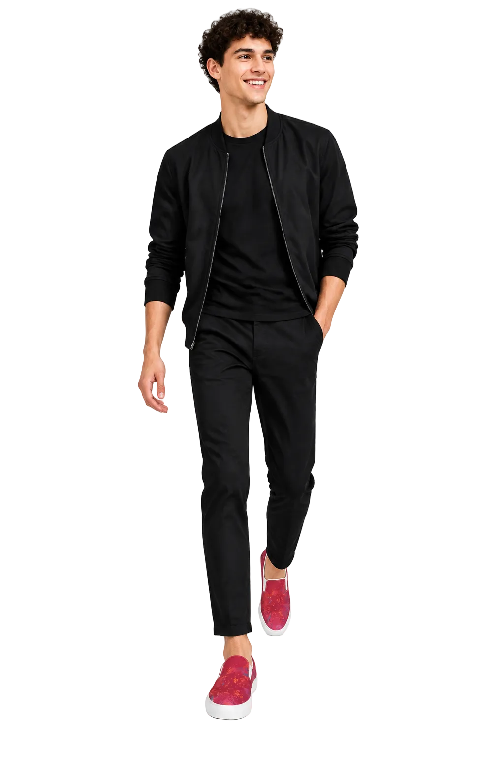 A man modeling a black bomber jacket, black crewneck t-shirt, black slim-fit trousers, and bright pink slip-on sneakers against a plain white studio background.