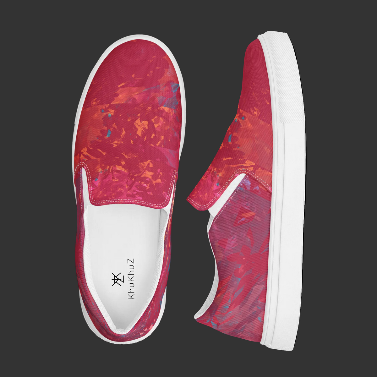 A pair of slip-on canvas sneakers shown from top and side views on a white background. The shoes feature a vibrant red and orange abstract floral pattern with a thick white sole.