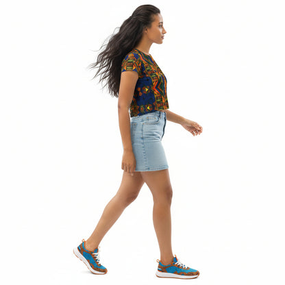 Woman wearing a colorful top and denim shorts on a white background
