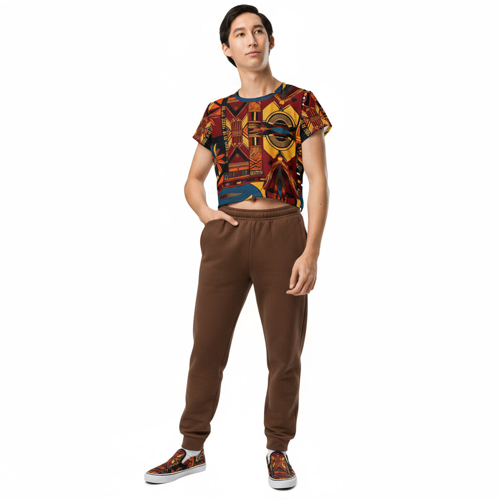 Person wearing a colorful patterned shirt and brown pants on a white background