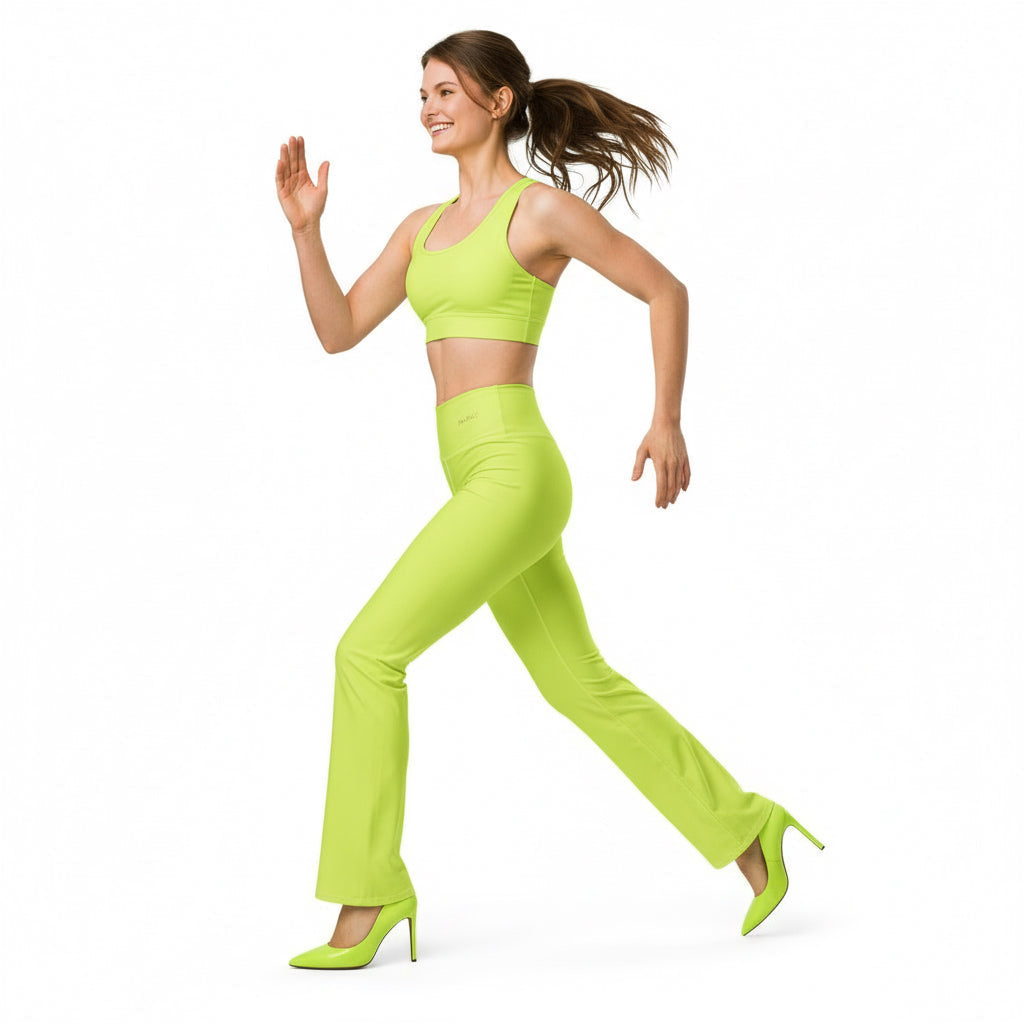 A model wearing neon green high-waisted flared leggings with a butt-lifting cut and a double-layered waistband.