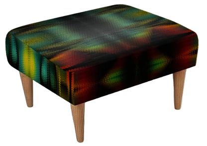 A square upholstered foot stool with a dark abstract pattern in green, yellow, red, and black, supported by four light wood legs on a textured white background.