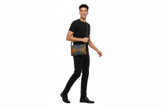 Man holding a patterned khukhuz bag against a white background
