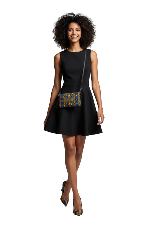 Woman wearing a black dress with a patterned handbag on a gray background