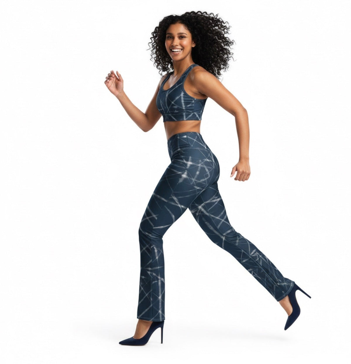 Woman wearing a blue tie-dye athletic outfit on a white background