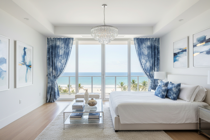 Modern living room with ocean view, white sofa, and decorative elements.