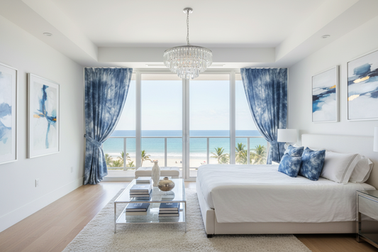 Modern living room with ocean view, white sofa, and decorative elements.