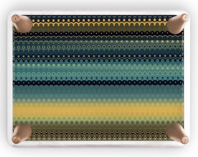 A rectangular footstool with rounded corners, featuring a horizontal striped pattern of black, teal, and yellow halftone dots, shown on a white background with a soft drop shadow.