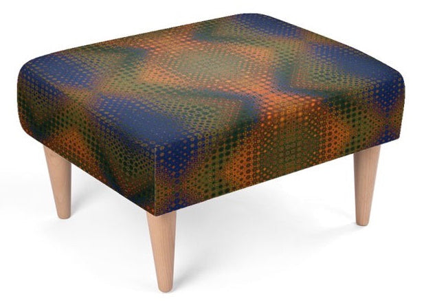 A square upholstered ottoman with a geometric halftone pattern in navy blue, green, and brown, supported by four tapered light wood legs on a white background.