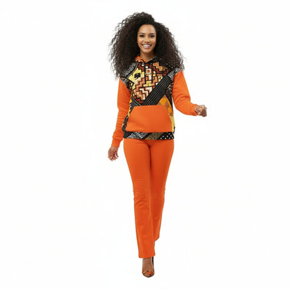 Woman wearing an orange outfit with a patterned top on a white background