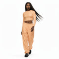 wearing low waist very buggy same colour as crop top pants with  black platform shoes. 