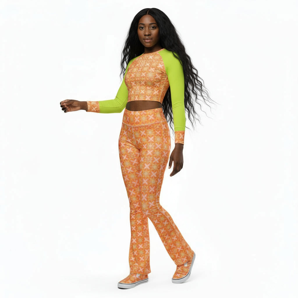 A model wearing a long-sleeve crop top with peach fuzz and neon green sleeves