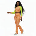 A model wearing a long-sleeve crop top with peach fuzz and neon green sleeves