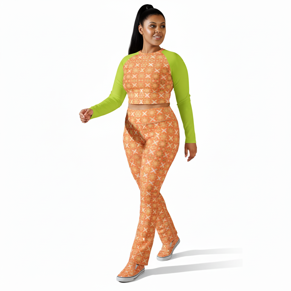 Woman wearing a green long-sleeve top with an orange patterned crop top a