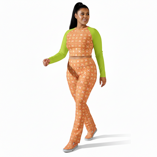 Woman wearing a green long-sleeve top with an orange patterned crop top a