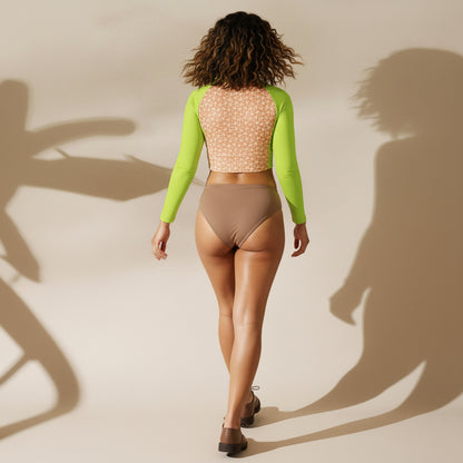 Woman wearing a neon green crop top with mocha mousse bikini and oxford shoes