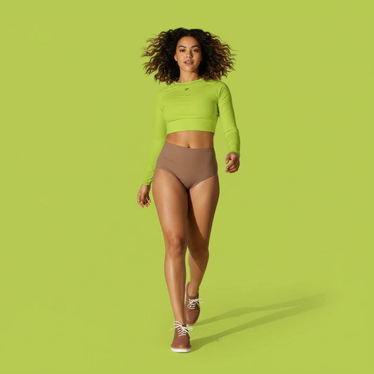 Woman wearing a neoan green long-sleeve crop top 