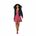 Woman wearing a pink dress with a black jacket on a white background