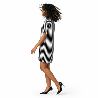 Woman wearing a black and white striped dress on a white background