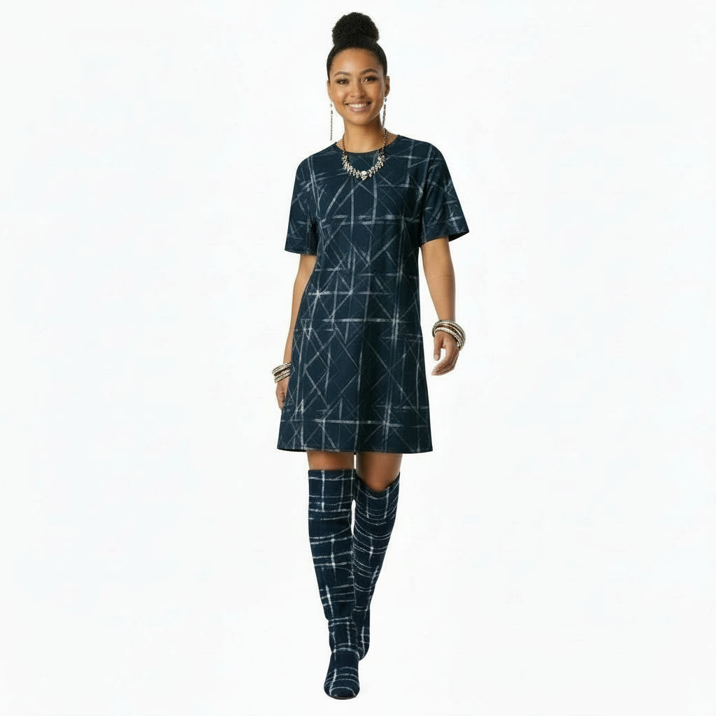 Woman wearing a blue geometric patterned dress on a white background