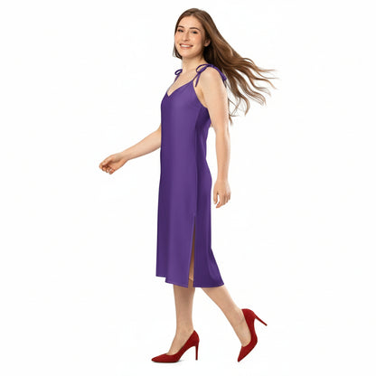 Woman wearing a purple slip dress on a white background
