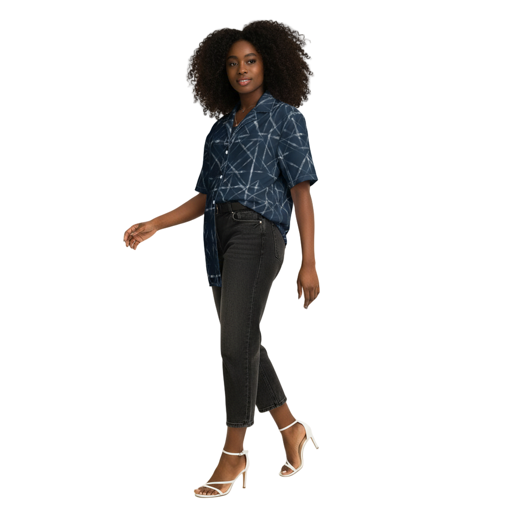 A person wearing a navy blue button-up shirt with a geometric pattern, paired with black pants and white sandals