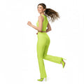 Woman in a neon green outfit running on a white background