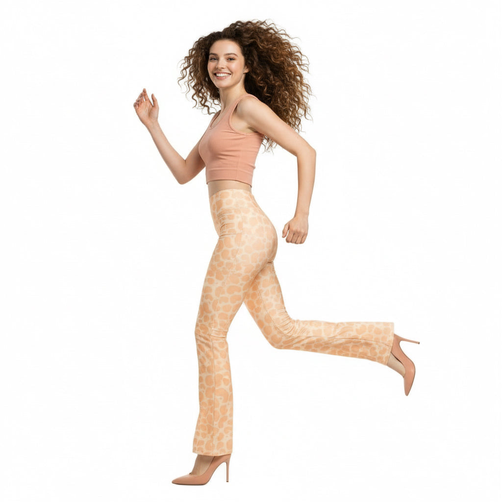 Woman wearing giraffe print pants on a white background