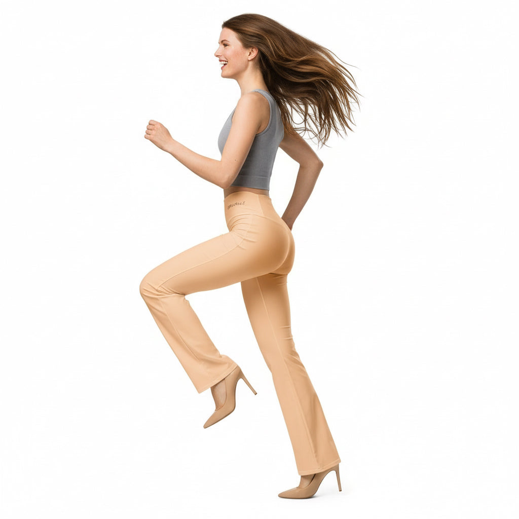 Woman wearing beige flared pants and a gray top on a white background