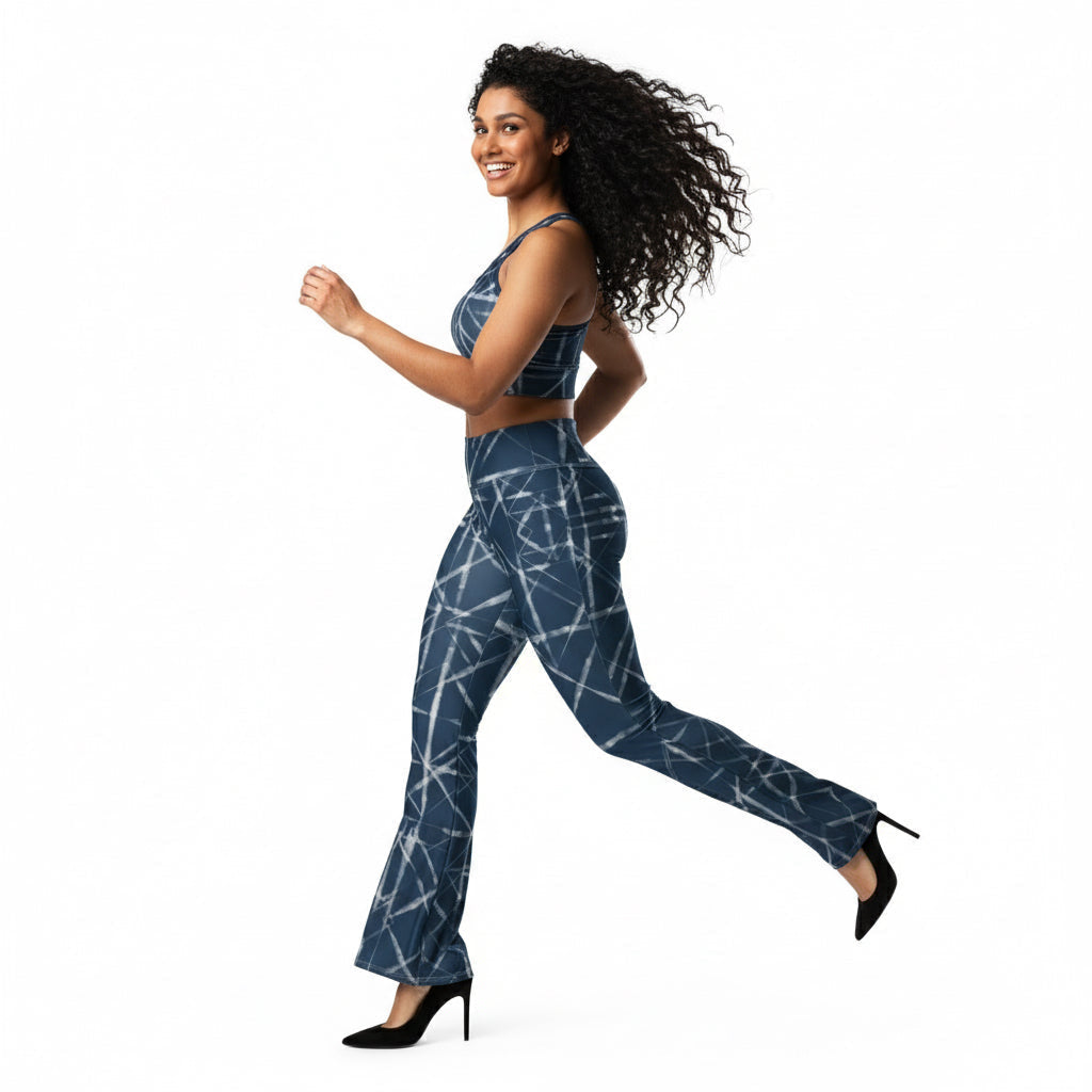Woman wearing a blue patterned jumpsuit on a white background