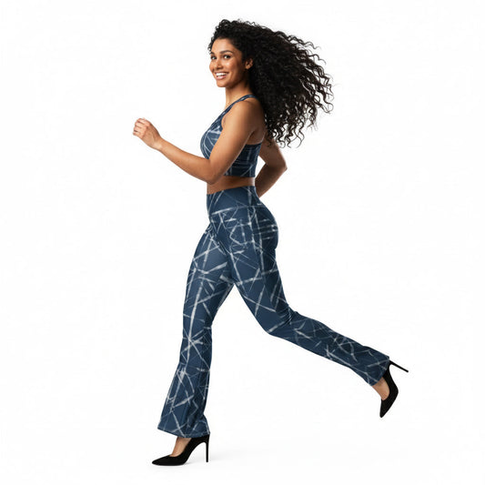 Woman wearing a blue patterned jumpsuit on a white background