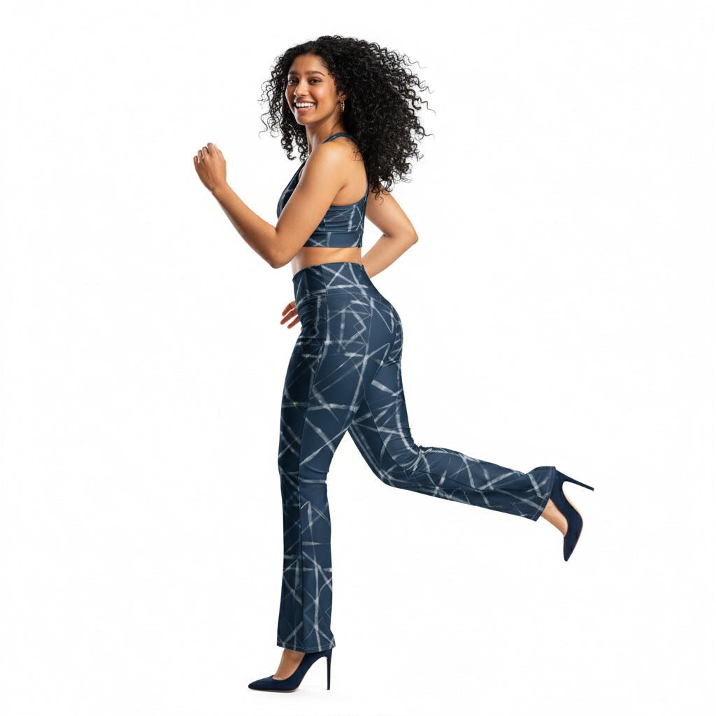 Woman wearing a blue geometric patterned outfit on a white background