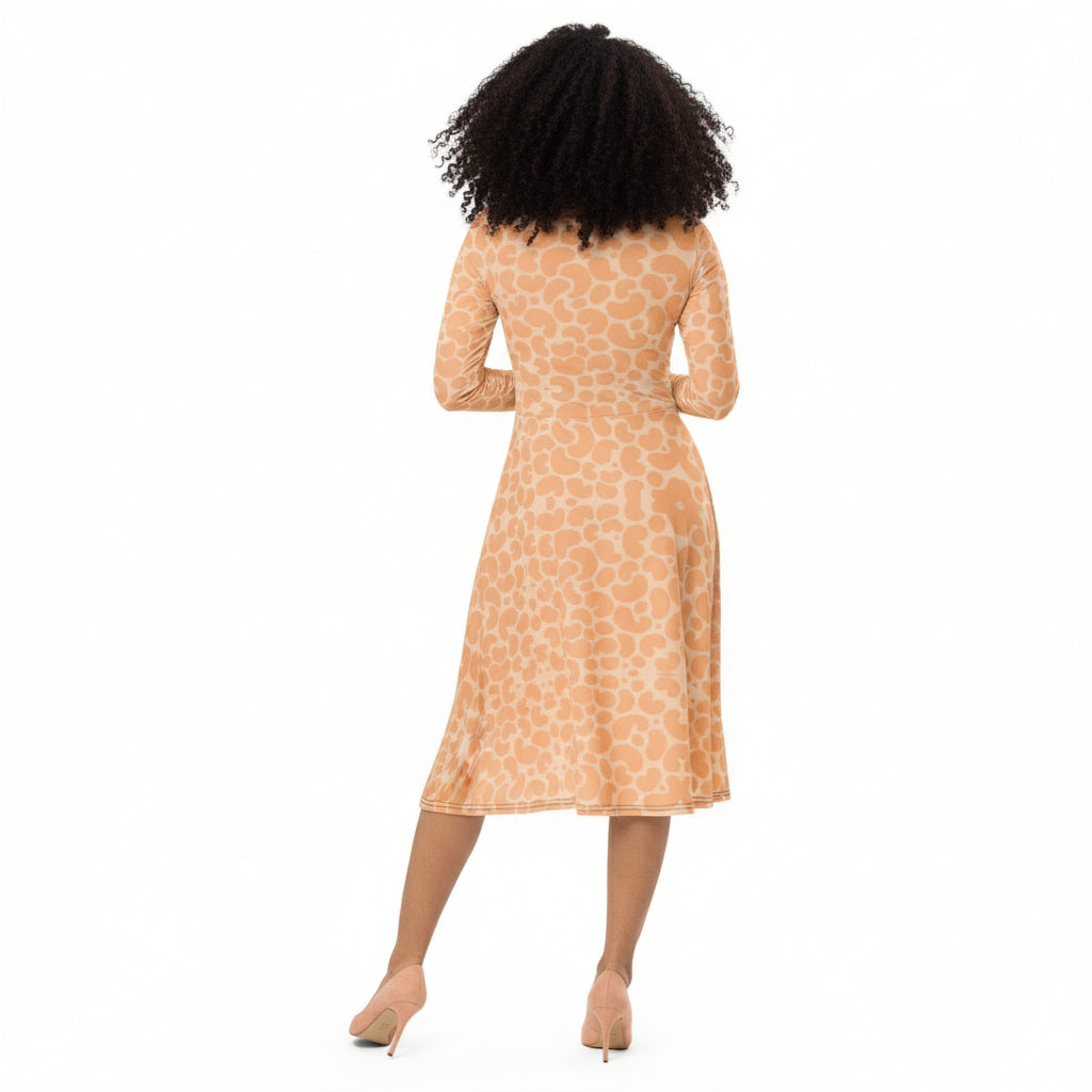 Woman wearing a patterned dress on a white background
