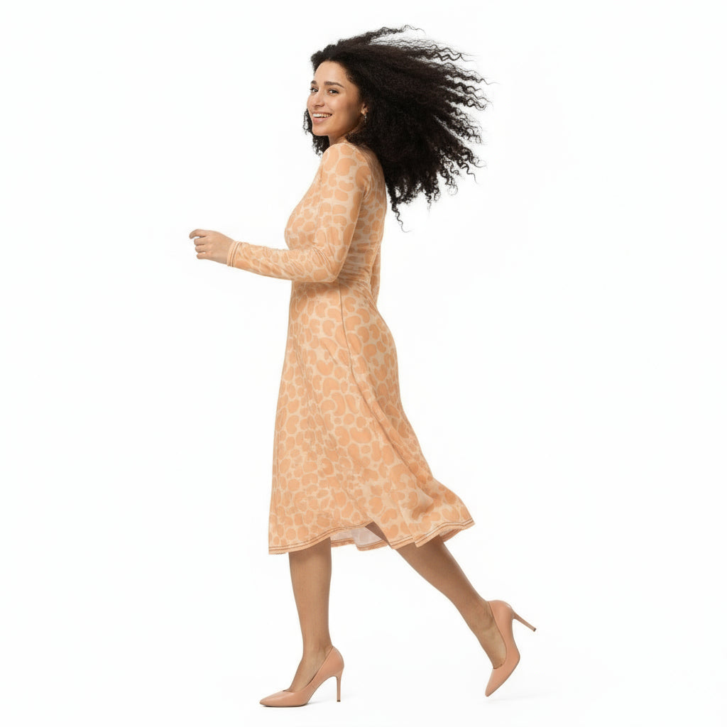 Woman wearing a patterned dress on a white background