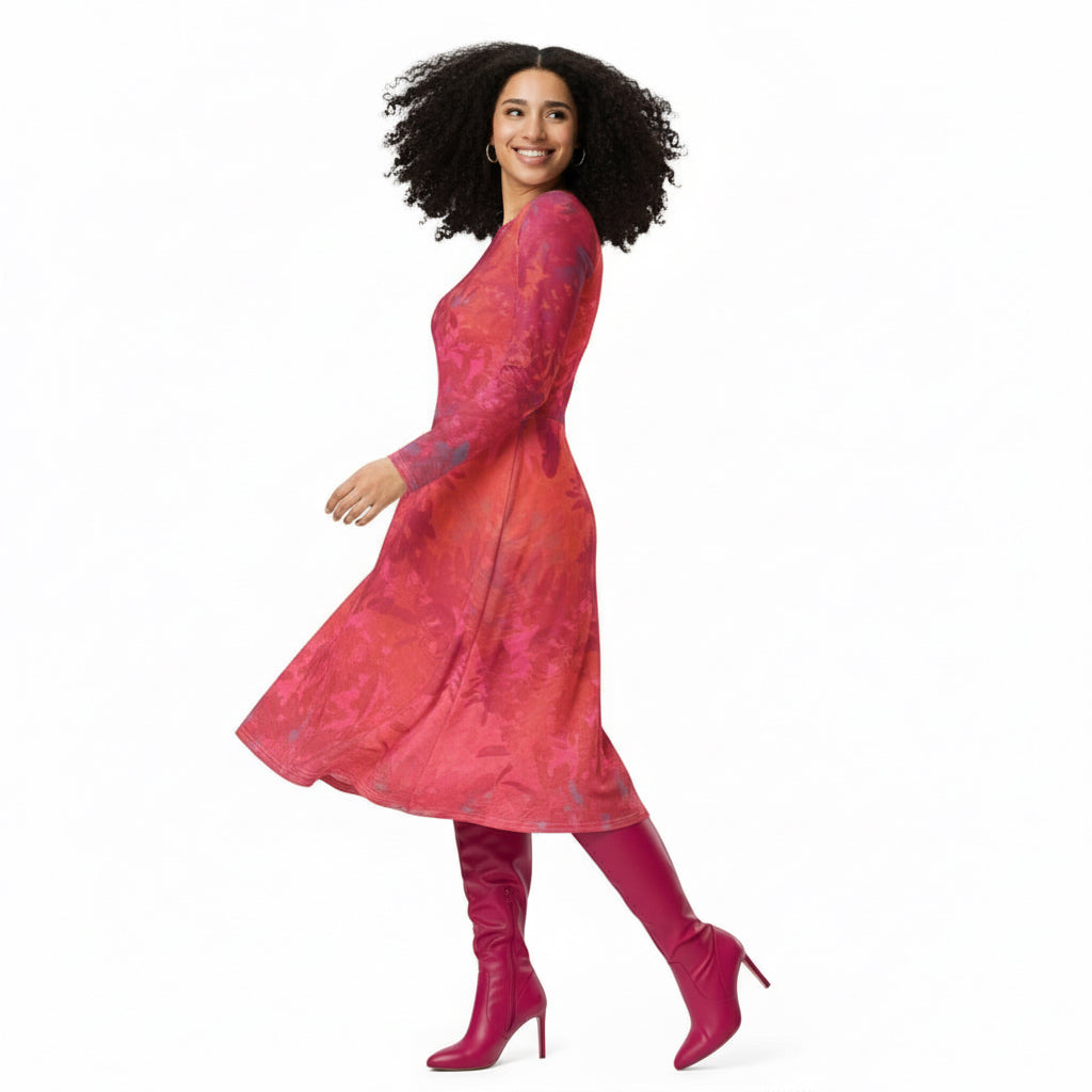 Woman wearing a floral viva magenta long sleeve print dress. Wearing knee high boots