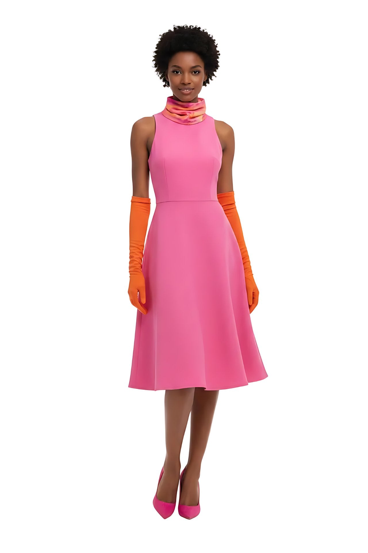 Woman wearing a pink dress with orange gloves and shoes on a white background