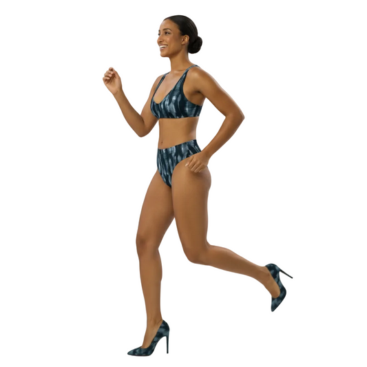 Woman wearing a blue tie-dye bikini on a white background