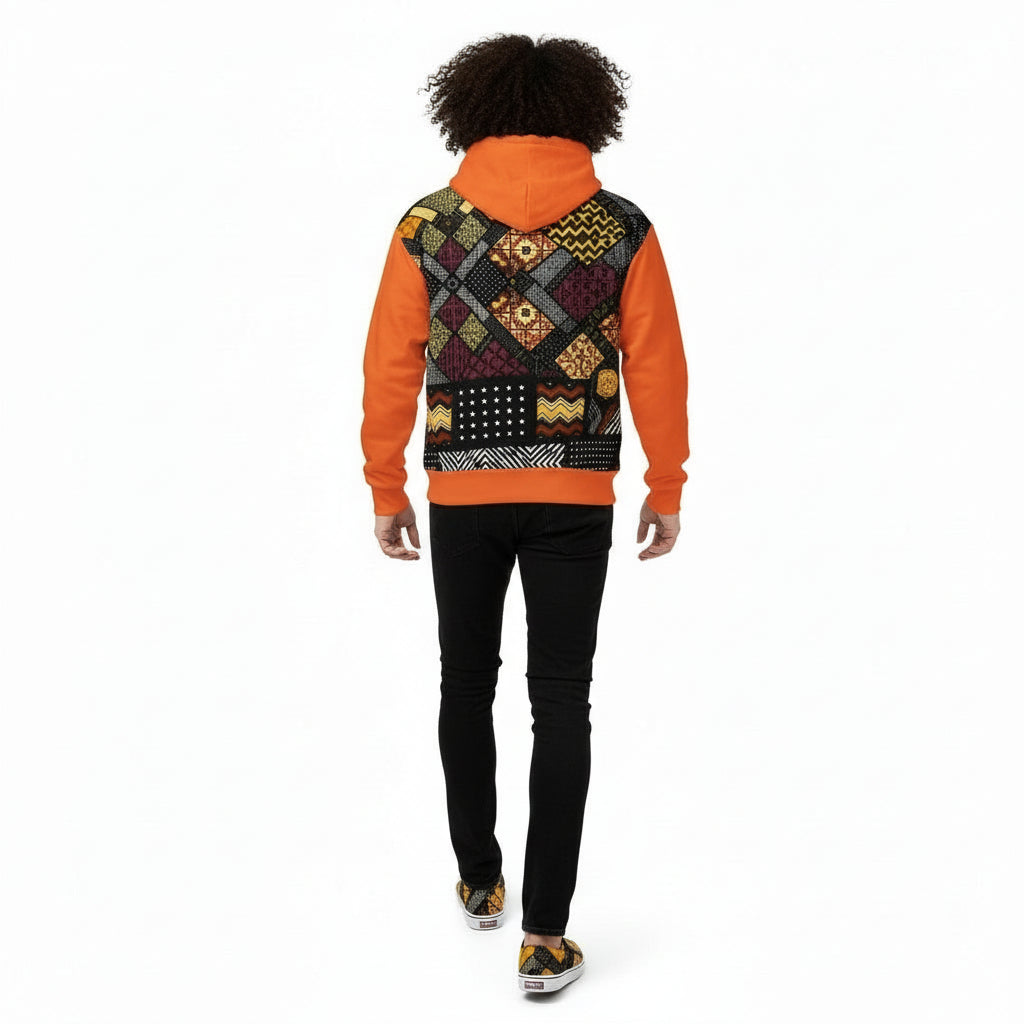 Person wearing a colorful patterned hoodie with an orange sleeve on a white background