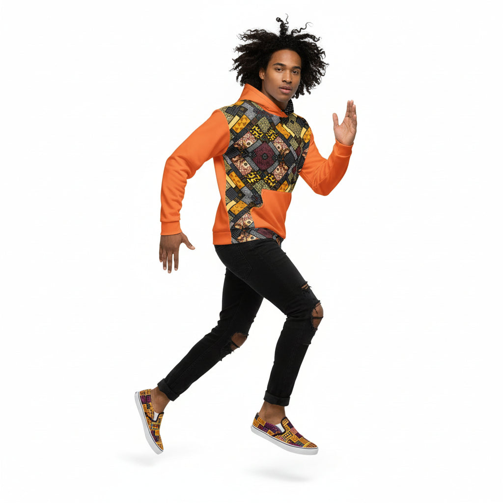 Person wearing a colorful patterned hoodie with orange sleeves on a white background