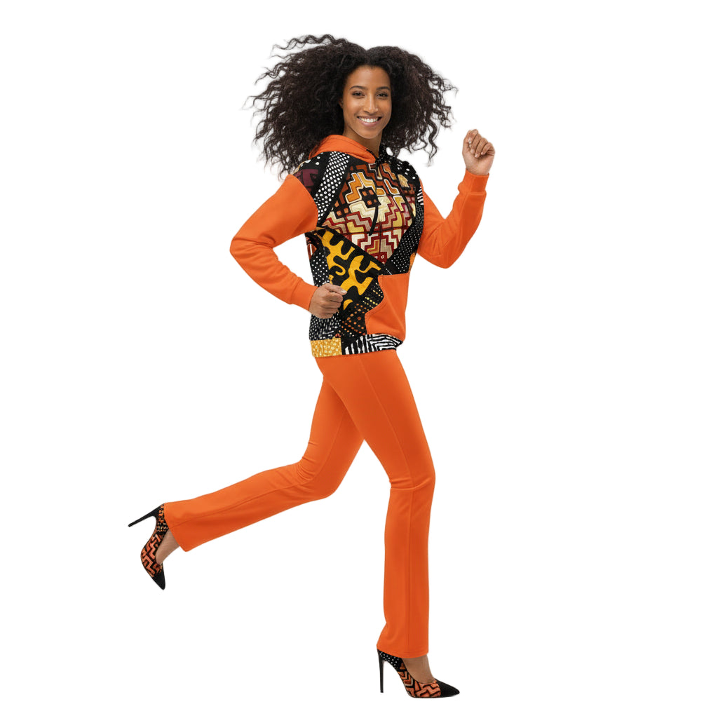 Woman wearing an orange outfit with a patterned scarf on a white background