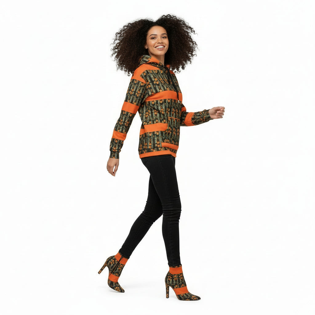 Man wearing a patterned hoodie with orange accents on a white background